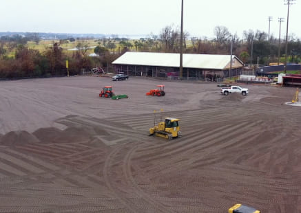 Sprinturf replacement install with new turf rolls being seamed